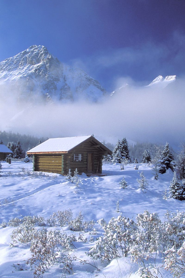 Winter cabin in the mountains