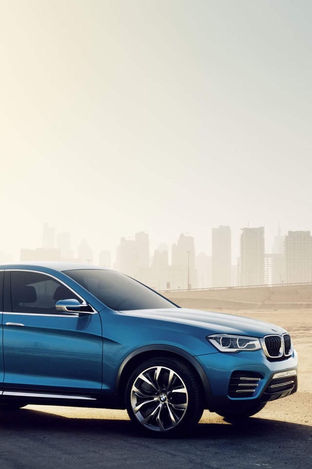 Синий BMW X4 кроссовер на городском пейзаже
