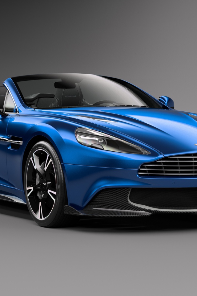 Синий кабриолет  Aston Martin Vanquish S Volante на сером фоне 