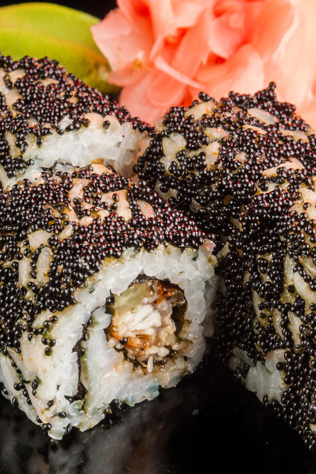 Appetizing rolls with black caviar