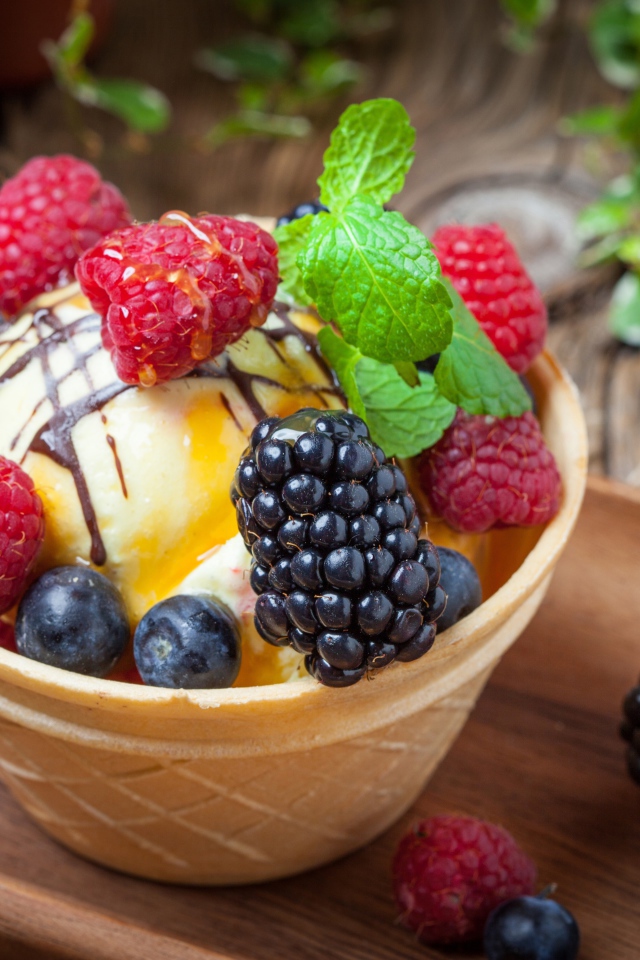 Ice cream in a waffle cup with fresh fruit