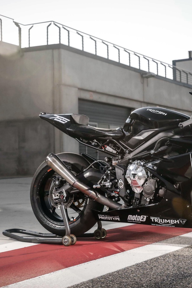 Black shiny motorcycle Triumph Daytona 765, 2019