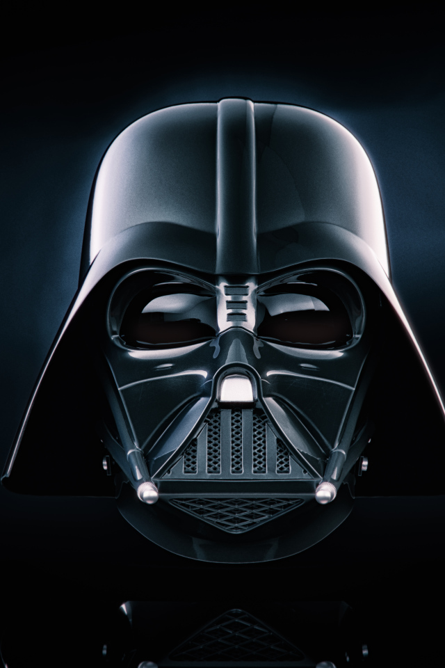 Face in a mask of Darth Vader on a black background