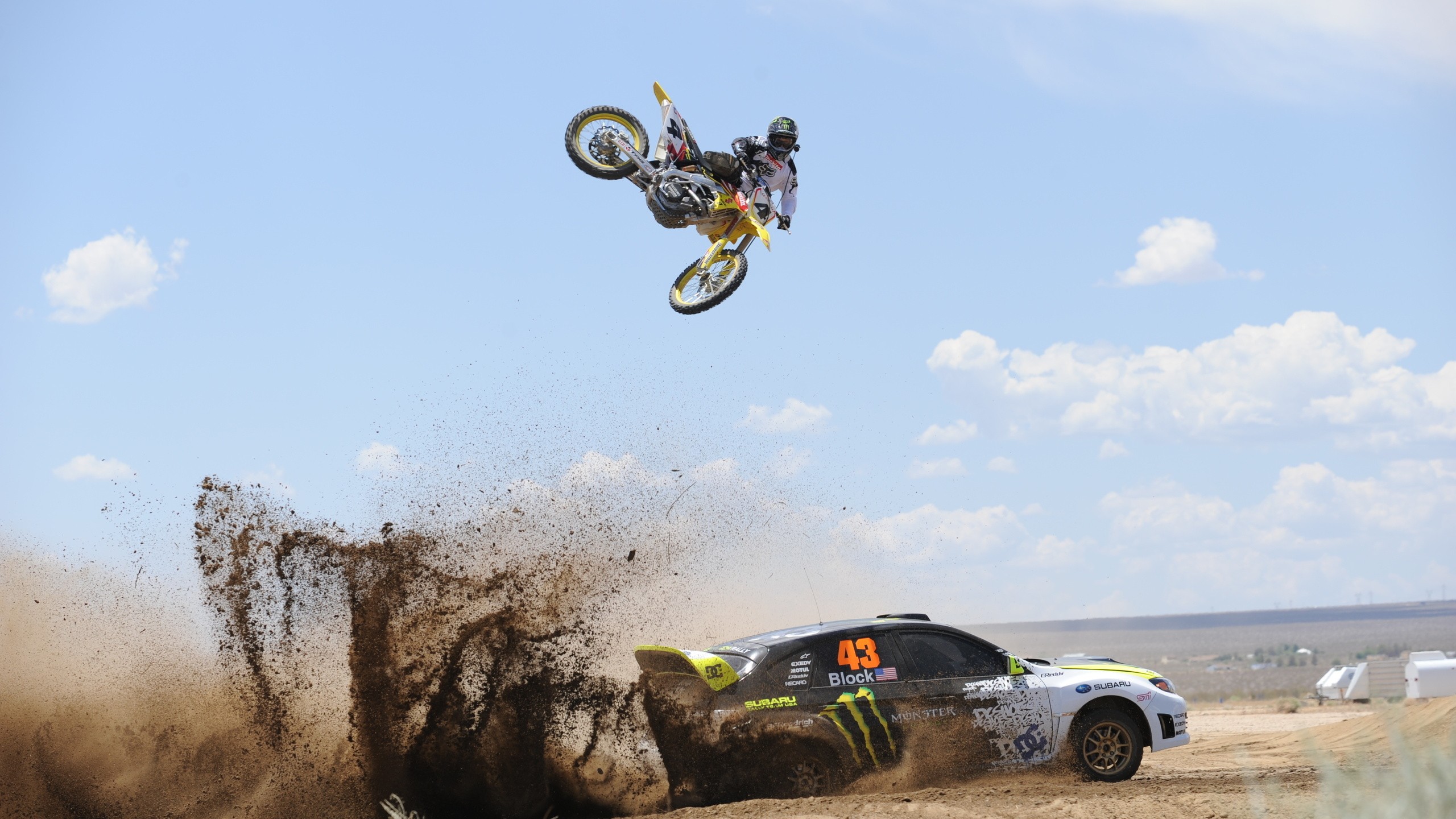Motorcycle and car on race in the desert wallpapers and images