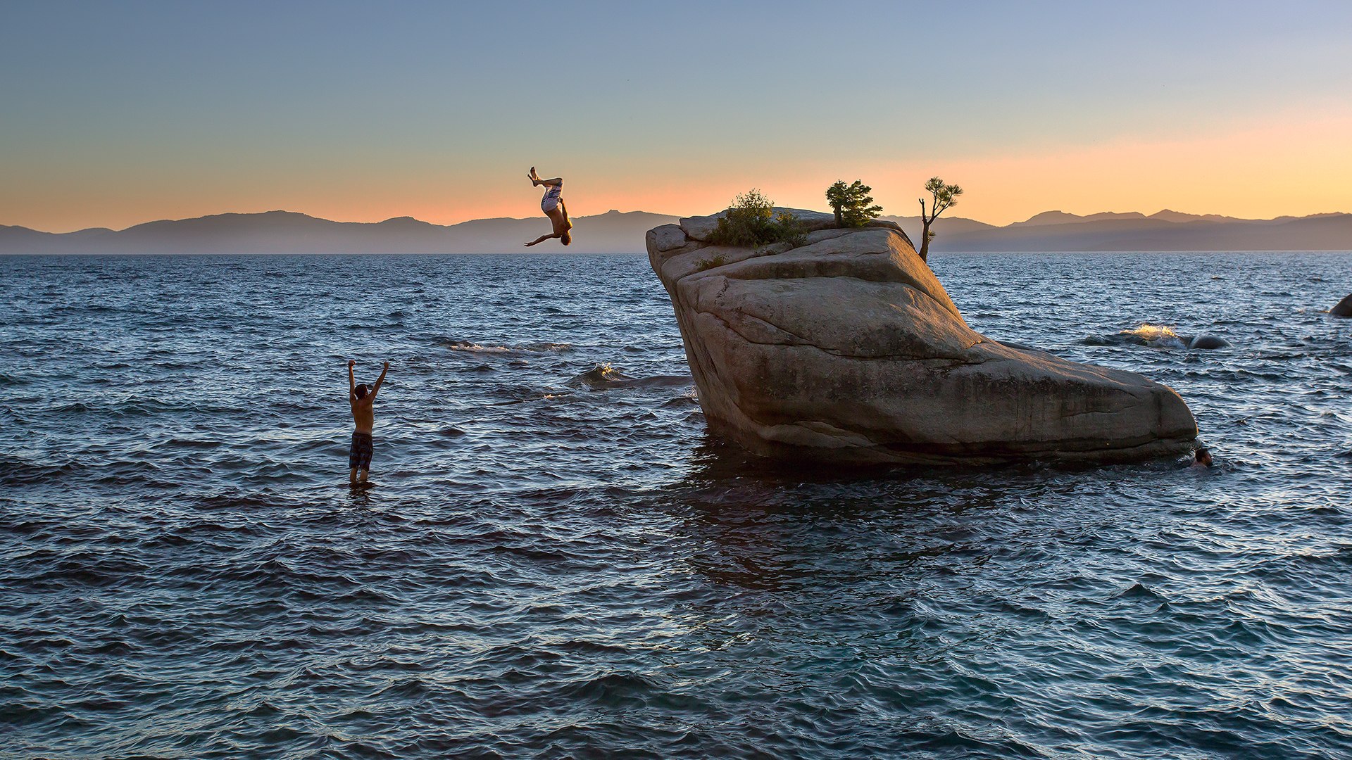 Jumping off a cliff near the shore wallpapers and images ...