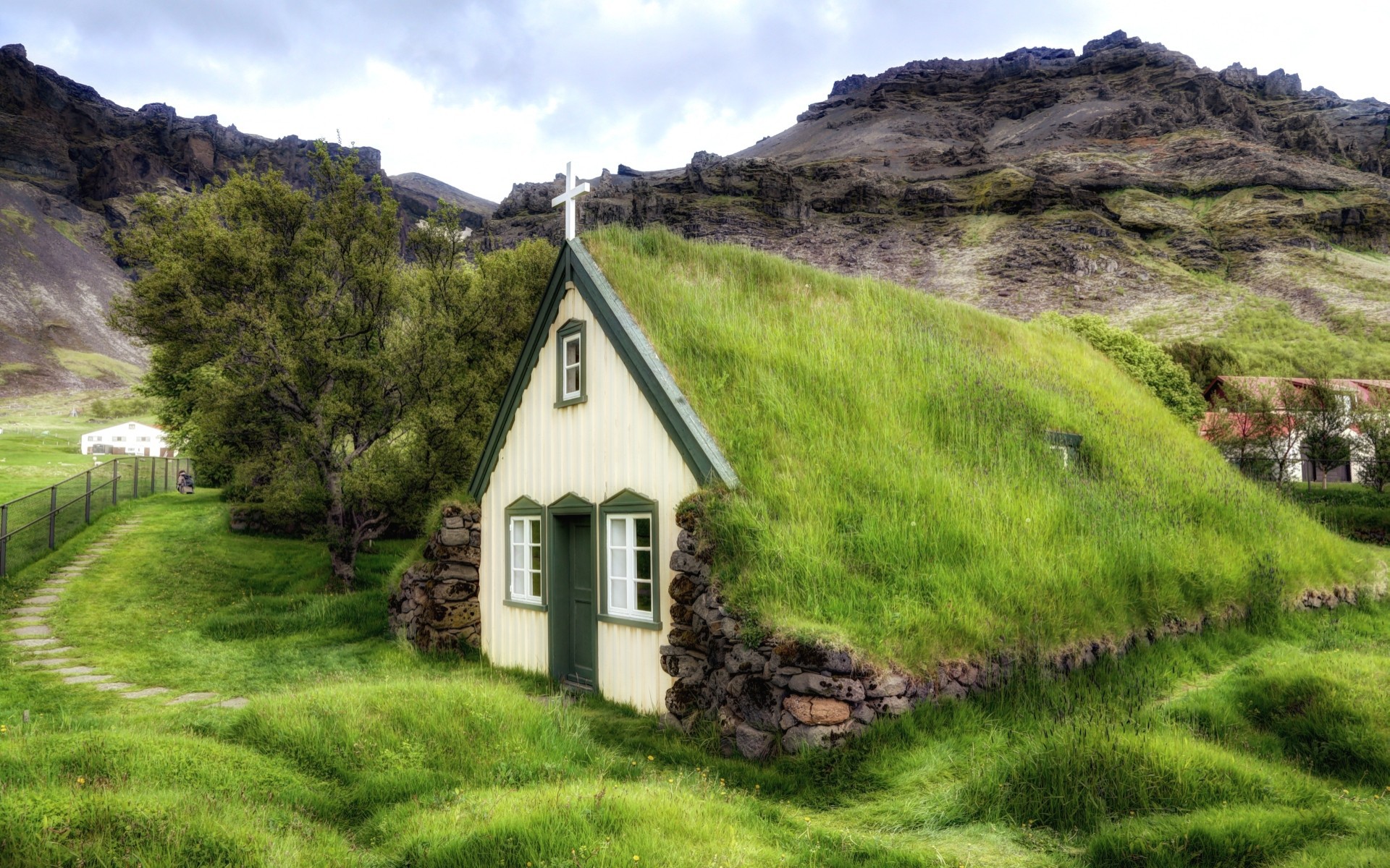 Grassy roof of the church in a mountain village wallpapers and images
