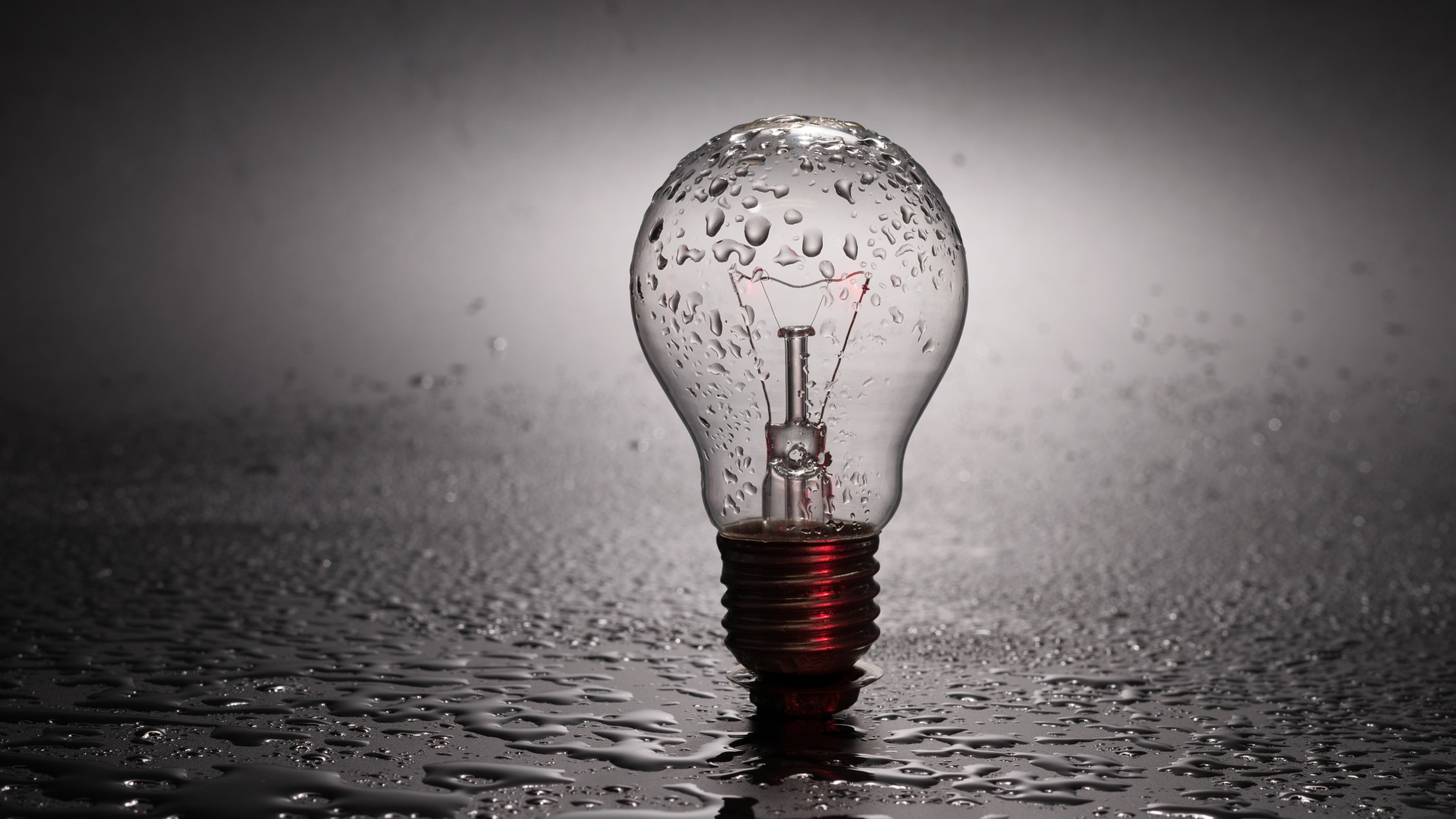 Glass bulb in drops of water wallpapers and images wallpapers