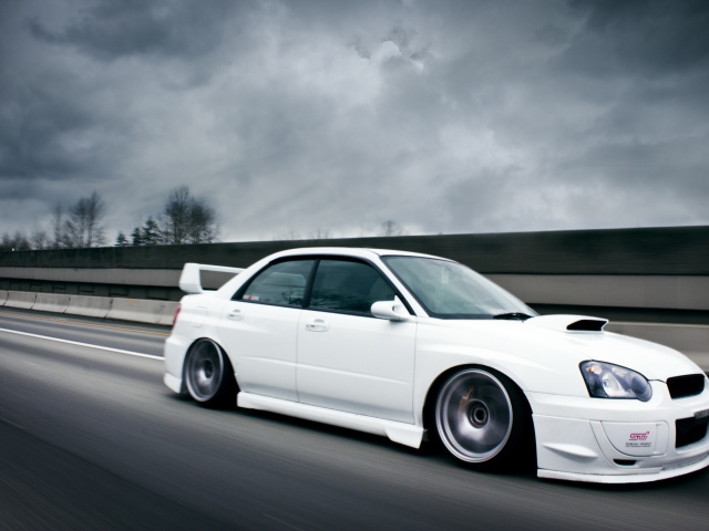 white Subaru Impreza STI