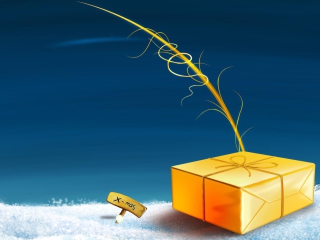 Жёлтая подарочная коробка лежит на снегу на рождество