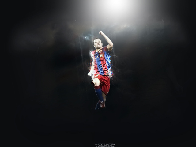 Игрок Барселоны Андрес Иньеста в прыжке