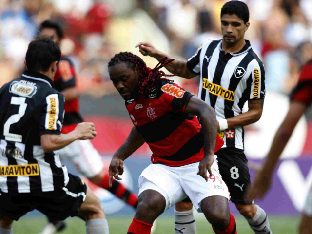 The player of Shandong Luneng Vagner battling for the ball