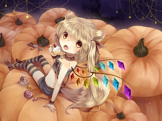 Девочка сидит на тыквах