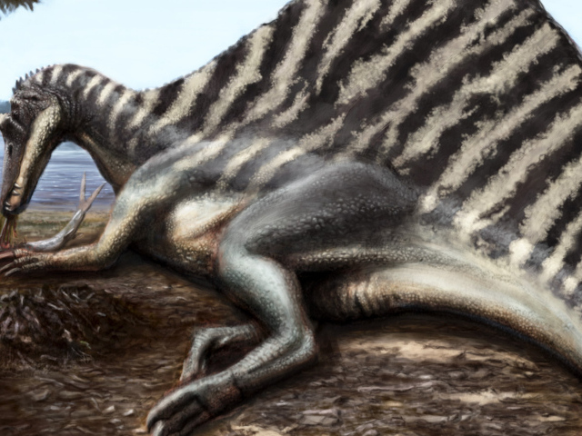 Обед динозавра на берегу реки