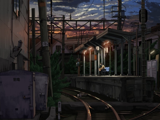 Одинокий парень на железнодорожной станции