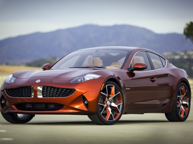 Автомобиль Fisker Karma цвета оранжевый металлик