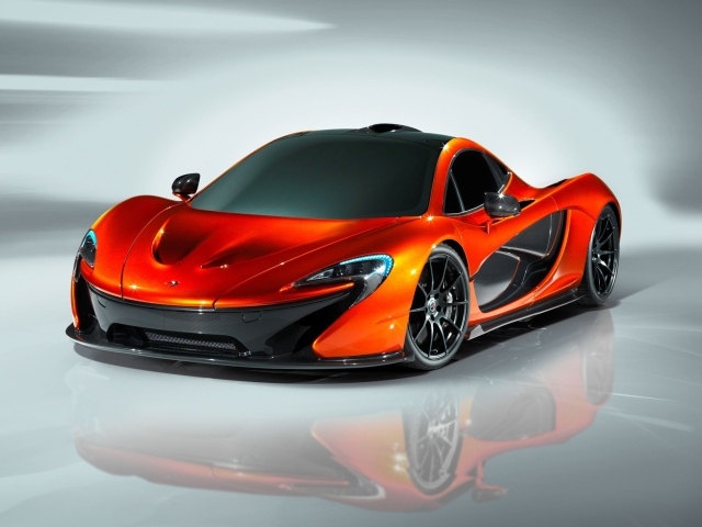 Оранжевый McLaren P1 на сером фоне