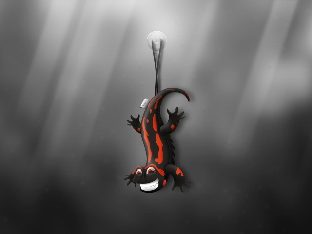 Ящерица игрушка, серый фон