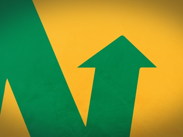 Зеленая стрела на желтом фоне