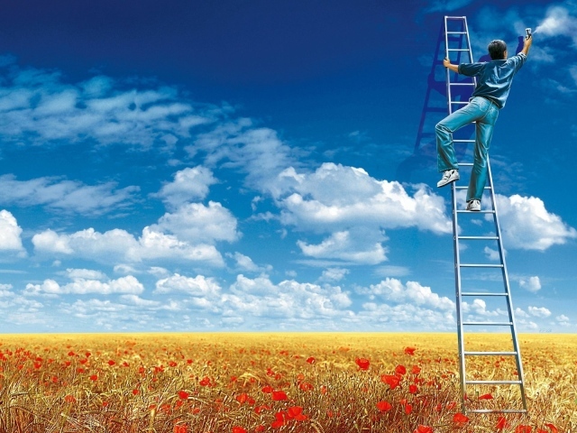 Мужчина рисует облака