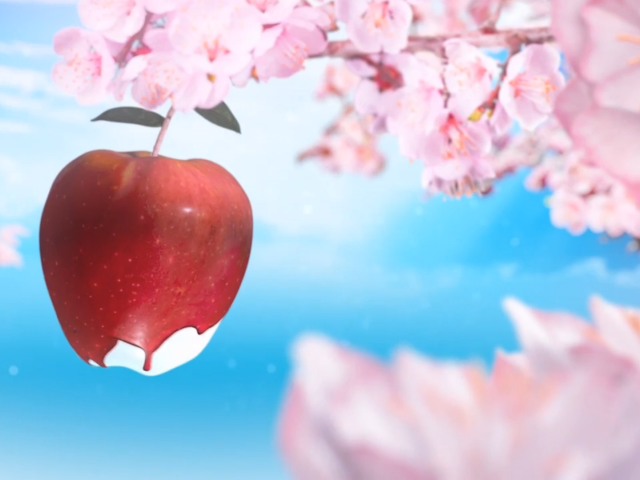 Красное яблоко среди розовых цветов