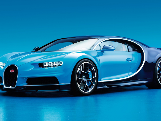 Голубой спортивный автомобиль Bugatti Хирон на голубом фоне