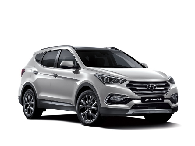 Серебристый автомобиль Hyundai Santa Fe  на белом фоне