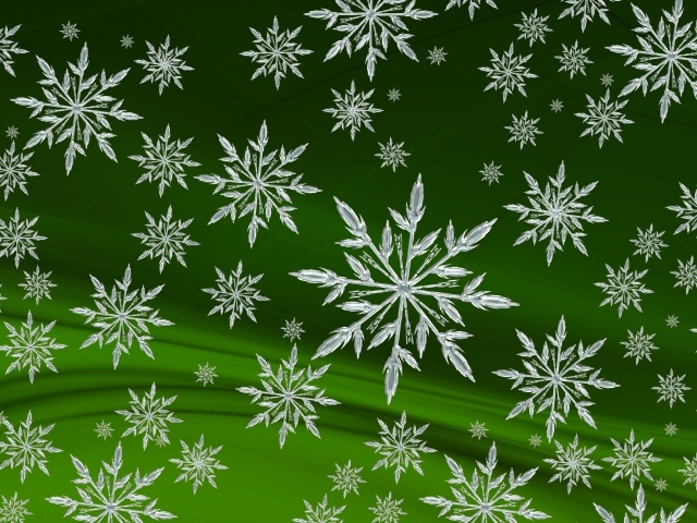 Кристальные белые снежинки на зеленом фоне