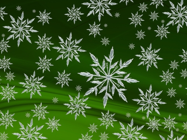 Кристальные белые снежинки на зеленом фоне