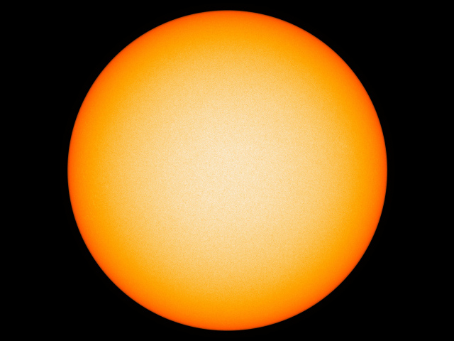 Яркое желтое солнце на черном фоне