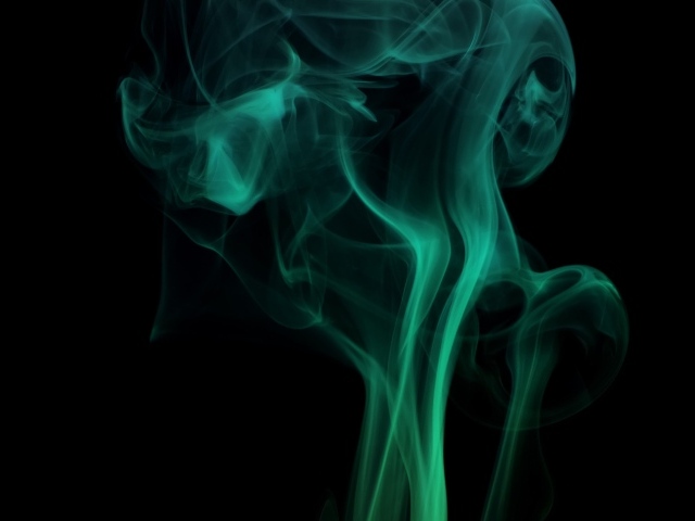 Зеленый дым на черном фоне