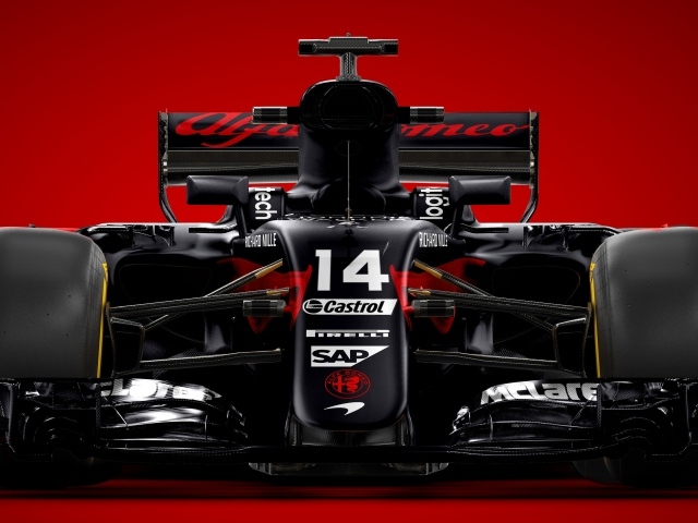 Гоночный автомобиль Formula 1 на красном фоне