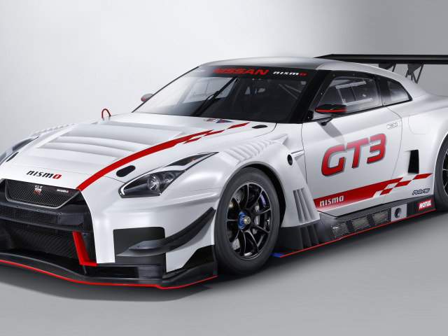Спортивный автомобиль Nissan GT-R Nismo GT3, 2018 на сером фоне