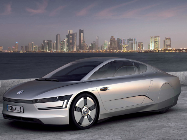 Автомобиль Volkswagen XL1 Concept,  2018 на фоне города