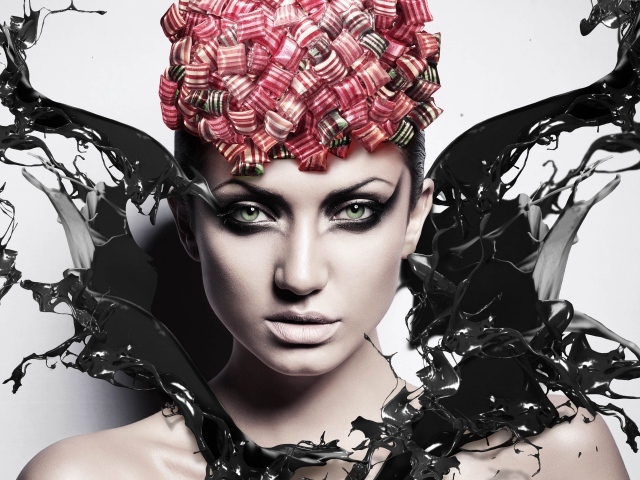 Красивая девушка с макияжем в брызгах черной краски