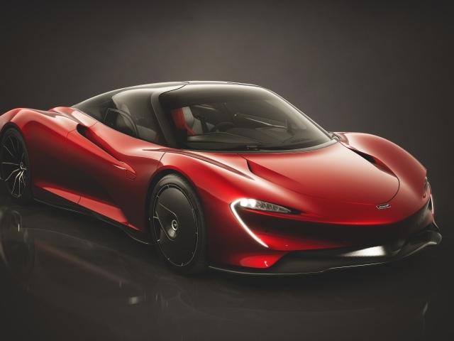 Красный автомобиль McLaren Speedtail Bloodline 2019 года на черном фоне