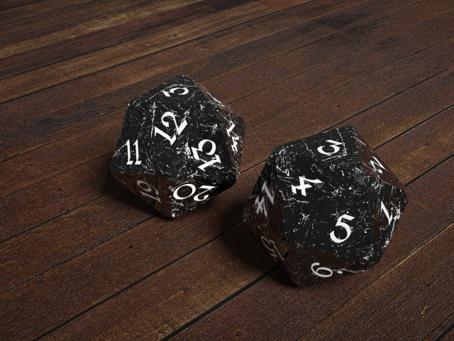 Два черных камня с цифрами на деревянном столе