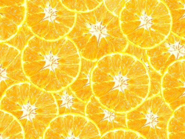 Оранжевый фон из кусочков апельсина крупным планом