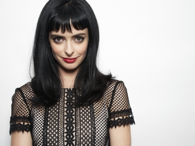 Американская актриса Кристен Риттер на сером фоне