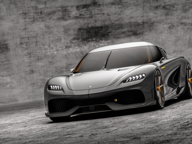 Автомобиль Koenigsegg Gemera 2020 года на сером фоне