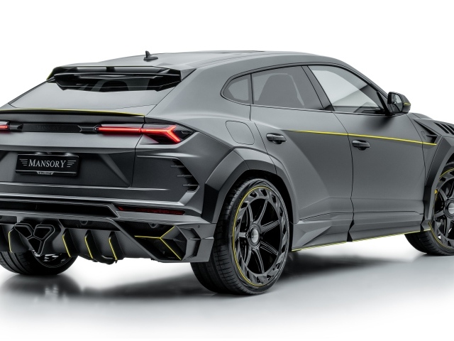 Серый внедорожник Lamborghini Urus 2019 года на белом фоне