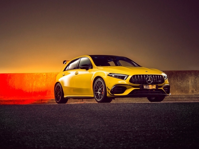 Желтый автомобиль Mercedes-AMG A 45 S,  2020 года на асфальте 