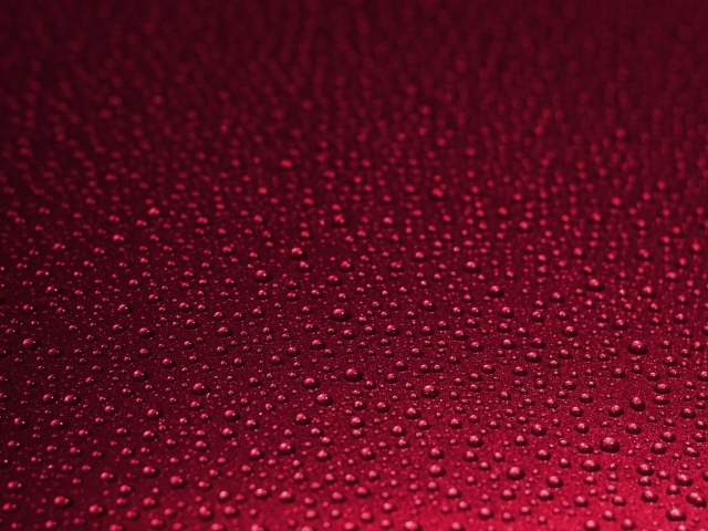 Красный фон с каплями воды 