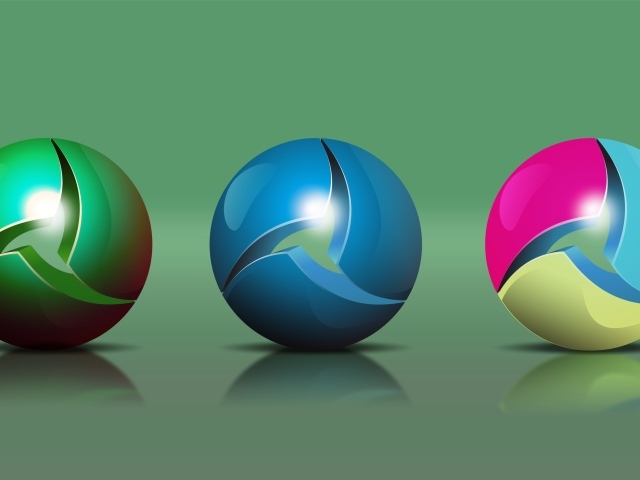 Три разноцветных 3д шара на зеленом фоне 