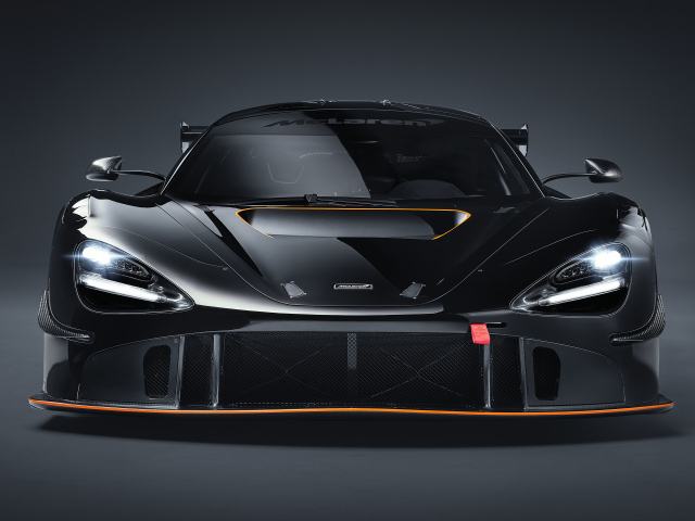 Автомобиль McLaren 720S GT3X 2021 года вид спереди на сером фоне