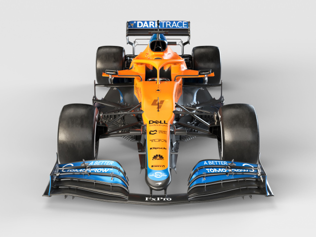 Гоночный автомобиль McLaren MCL35M 2021 года на сером фоне