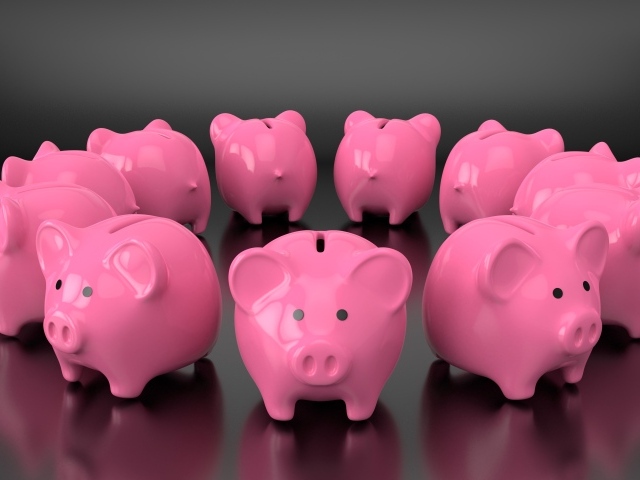 Много розовых свиней копилок на сером фоне