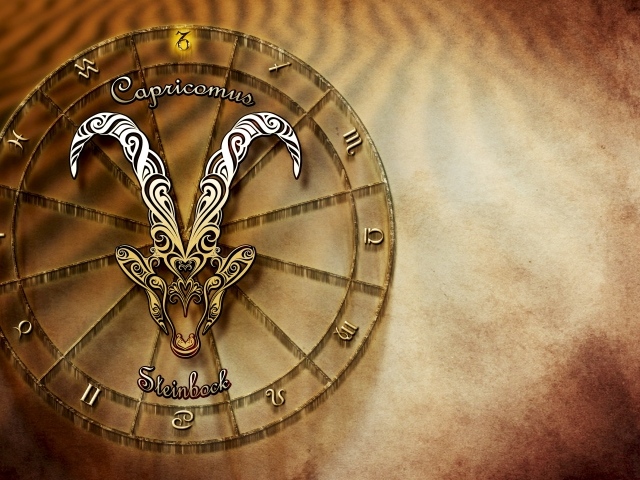 Зодиакальный знак козерог на оранжевом фоне