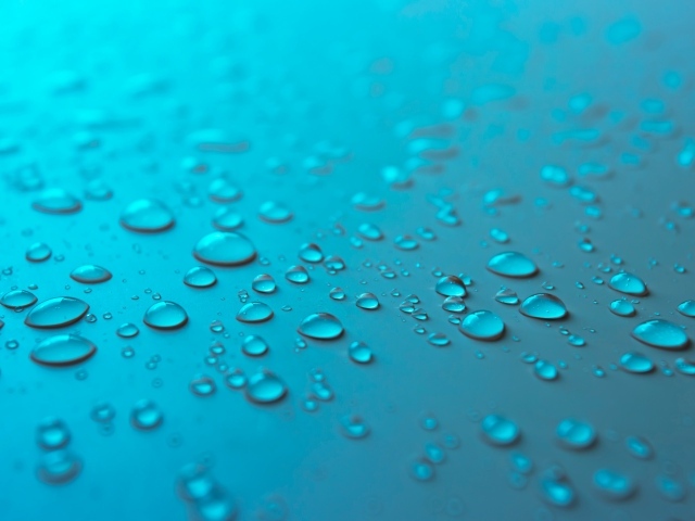 Голубой фон с каплями воды на поверхности