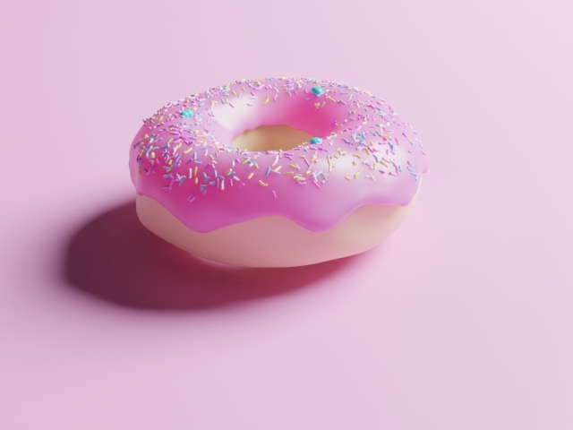 Пончик с глазурью на розовом фоне