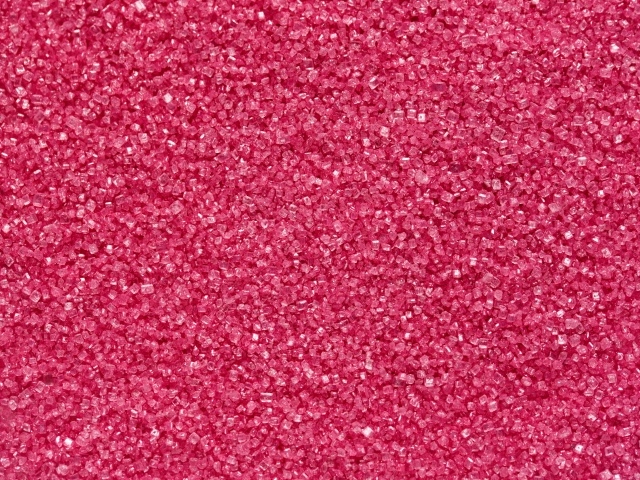 Мелкий розовый сахар для фона